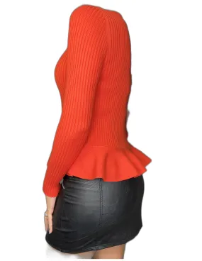 Pull rouge côtelé coupe péplum et col haut